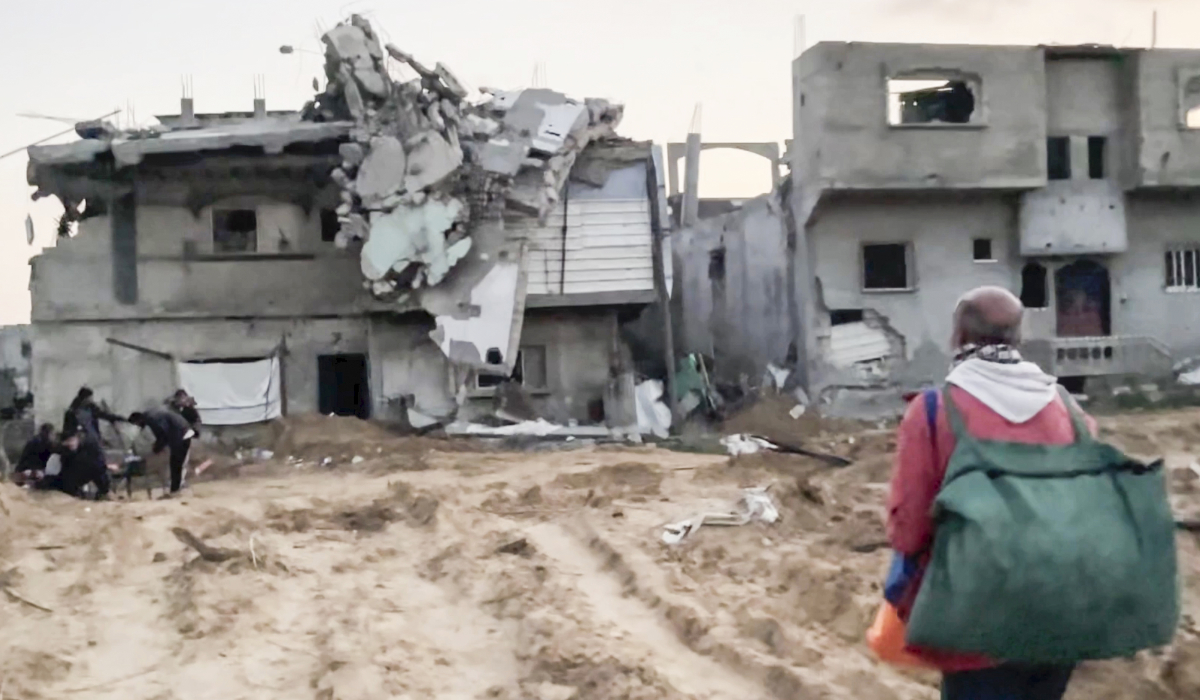 In this image made from an Associated Press video, Ne'man Abu Jarad and his family return to their home in Beit Lahiya, Gaza Strip, on Monday, Jan. 29, 2025, for the first time since the war between Hamas and Israel began. (AP)
