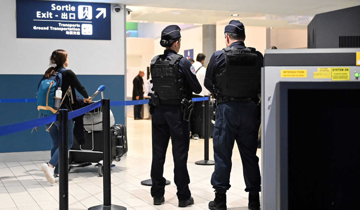 Police stand guard at the Roissy-Charles de Gaulle airport, in Paris, on October 18, 2024. (AFP)