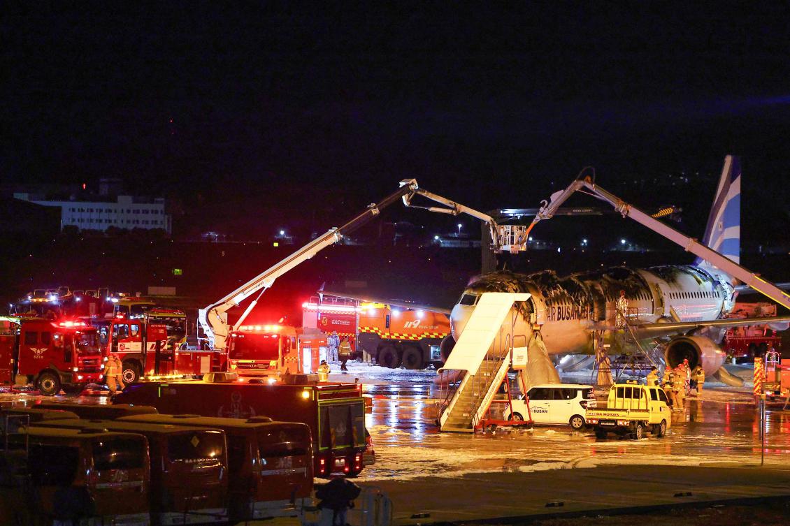 The National Fire Agency says that three people suffered minor injuries, likely bruises, during the evacuation.(AFP)