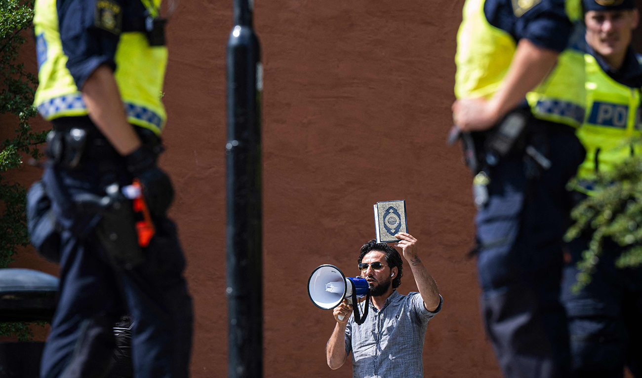 Salwan Momika protests outside a mosque in Stockholm on June 28, 2023, during the Eid Al-Adha holiday. Momika, who repeatedly burnt the Qur’an in 2023 in Sweden, sparking outrage in Muslim countries, has been shot dead, media reported on January 30, 2025, with police confirming a man died in a shooting the day before. (AFP/File)