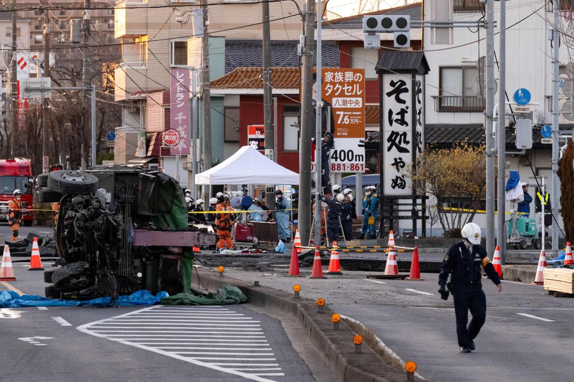The cavity has expanded to 40 meters across, almost the length of an Olympic swimming pool, since opening up in a city just north of Tokyo on Tuesday morning. (AFP)