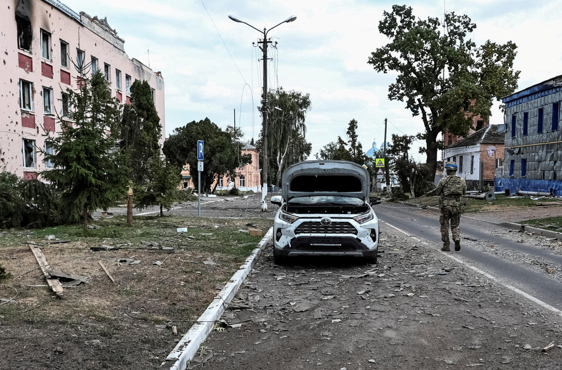 A Ukrainian serviceman patrols a street next to buildings in the town of Sudzha, Kursk region on Aug. 16, 2024. Ukraine controls dozens of border settlements in the Kursk region of western Russia. (Reuters)