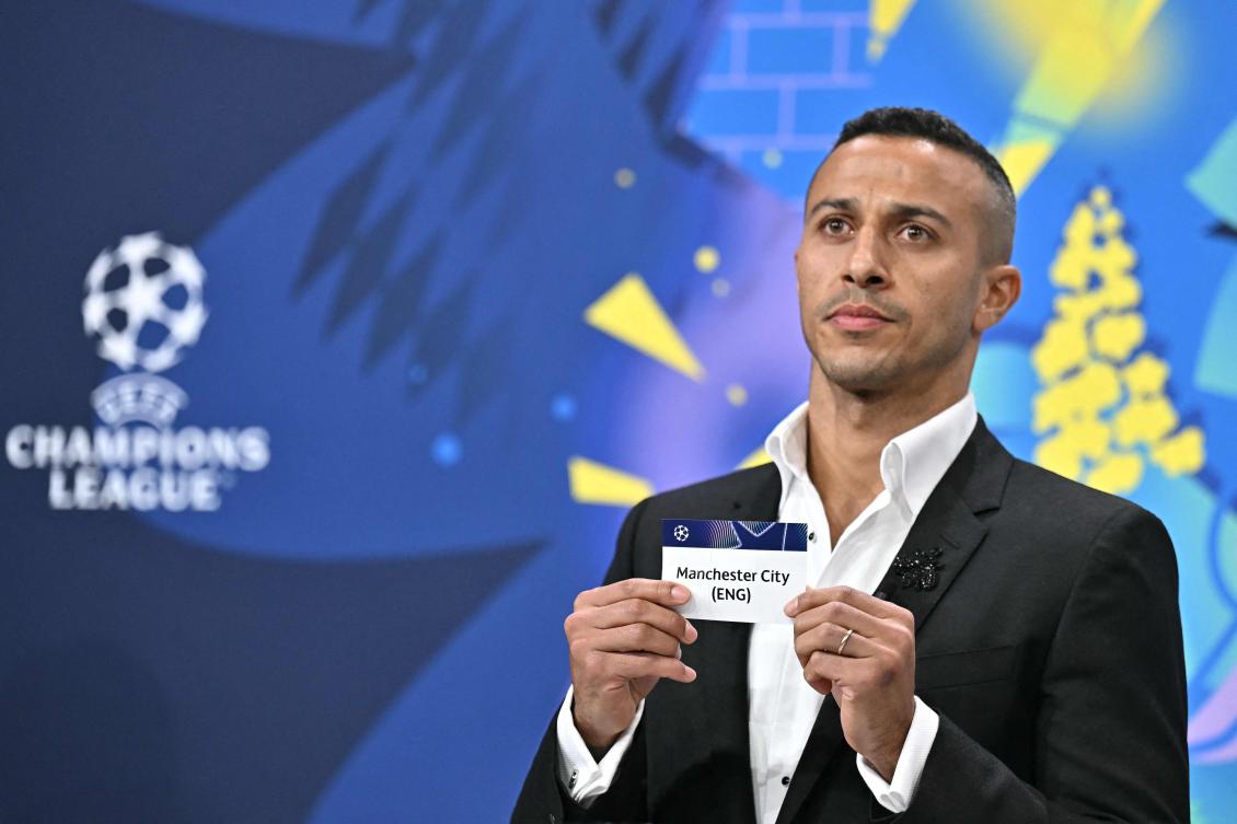 Former Spanish player Thiago Alcantara holds the paper slip of Manchester City during the 2024-2025 UEFA Champions League tournament knockout play-off draw on Jan. 31, 2025. (AFP)