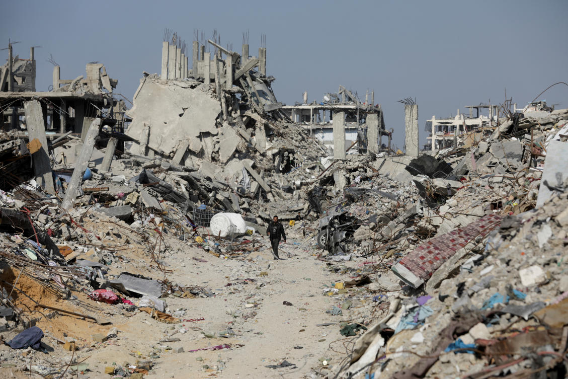 Palestinians walk through the rubble of houses and buildings destroyed during the Israeli offensive in Jabalia refugee camp in the northern Gaza Strip, Jan. 29, 2025. (Reuters)