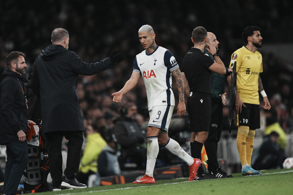 Tottenham’s Richarlison, center, and head coach Ange Postecoglou greet each other during a substitution at their Europa League opening phase match against Elfsborg at the Tottenham Hotspur stadium in London, Jan. 30, 2025. (AP)