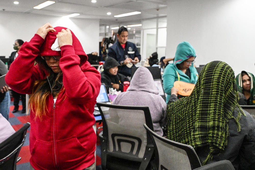 The raid in the Makati financial district was part of a crackdown against online crime operators that often act under the guise of gaming firms. (AFP)