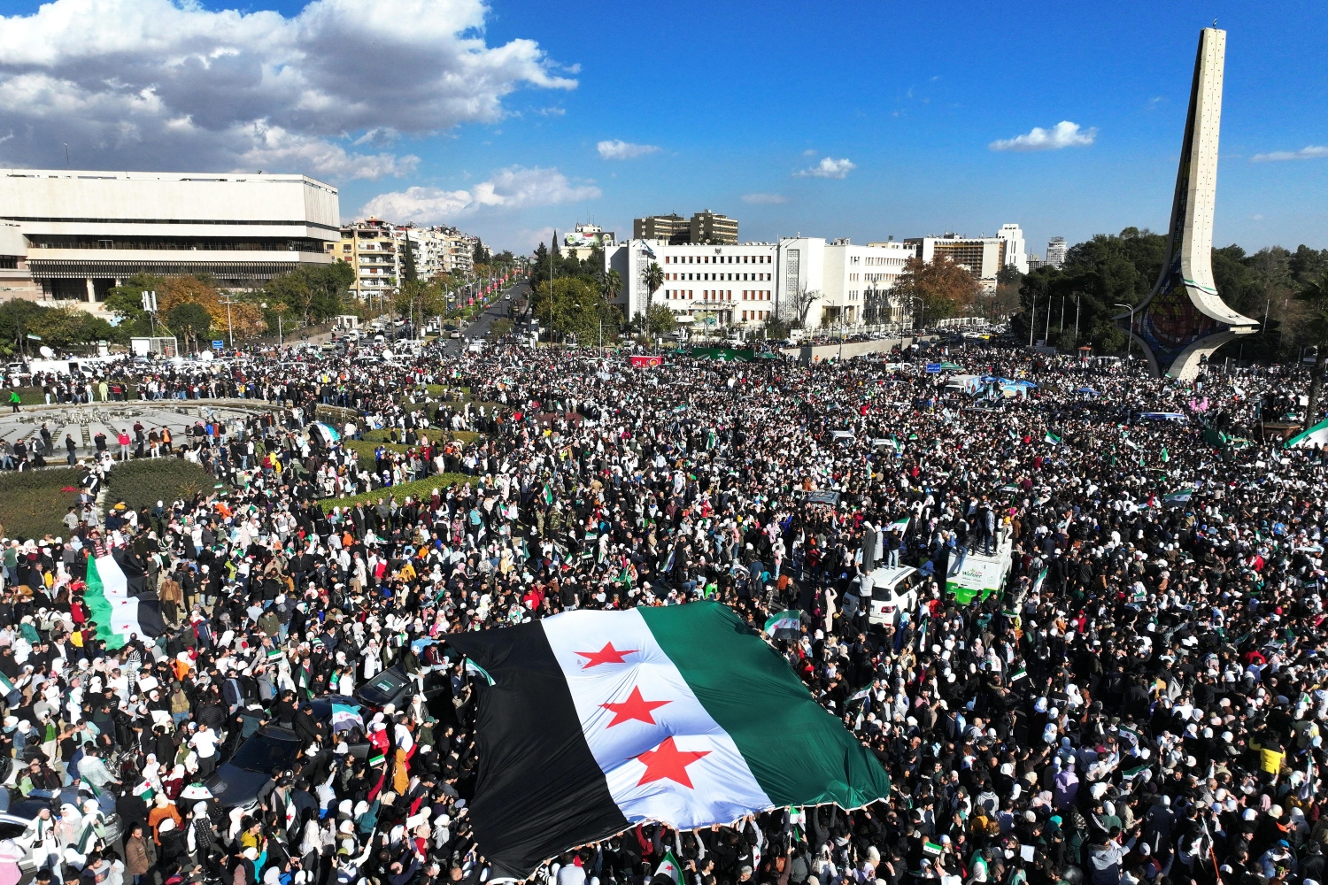 Syrians gather to celebrate the fall of Bashar Assad’s rule at the central Umayyad Square in Damascus. Dec. 13, 2024 (File/AFP)