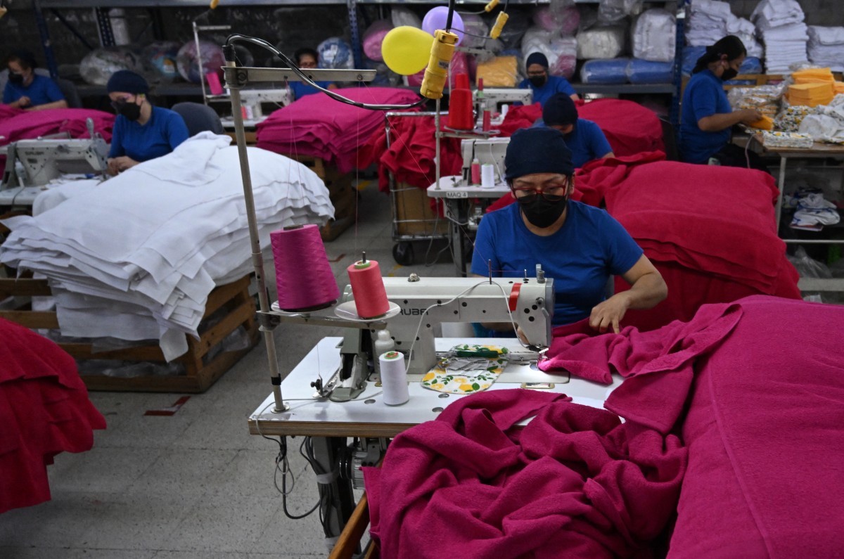 People work at a textile factory in Bogota, Colombia. (File/AFP)