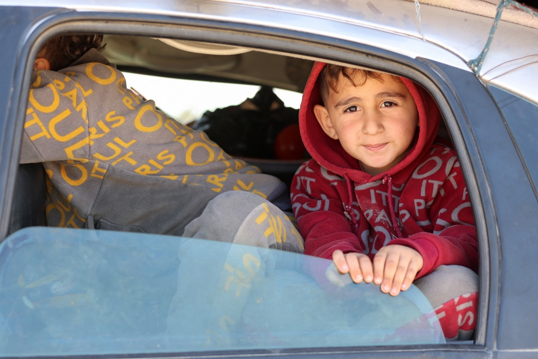 Columns of Palestinians carrying what belongings they could headed to north Gaza on January 29, for a third straight day. (AFP)