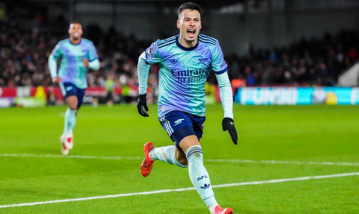 Arsenal's Gabriel Martinelli celebrates after scoring his side third goal during the English Premier League soccer match between Brentford and Arsenal at the Gtech Community stadium in London, Wednesday, Jan. 1, 2025. (AP)