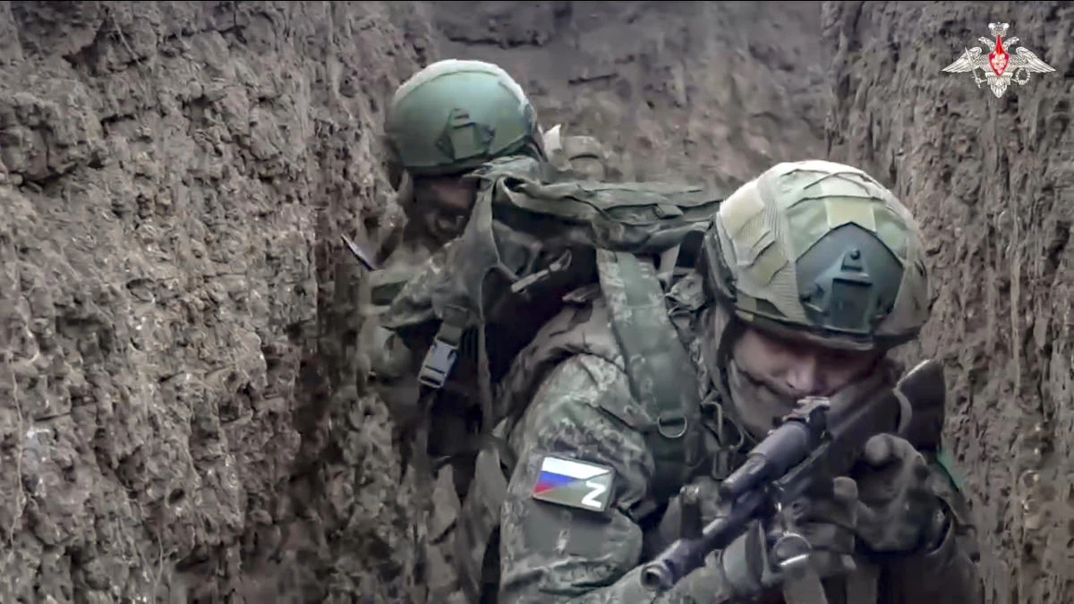Above, Russian servicemen attend a combat training for assault units in an undisclosed location. (Russian Defense Ministry Press Service via AP)