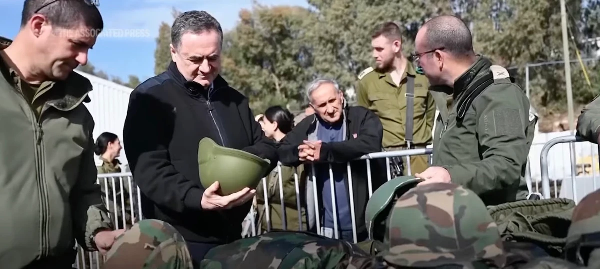 Israeli Defense Minister Israel Katz inspecting Israeli troops in the frontline with Lebanon. (Screen grab from AP video)