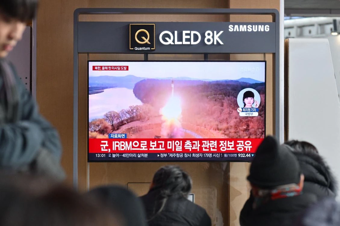 Above, people watch a television showing a news broadcast with file footage of a North Korean missile test at a railway station in Seoul on Jan. 6, 2025. (AFP)