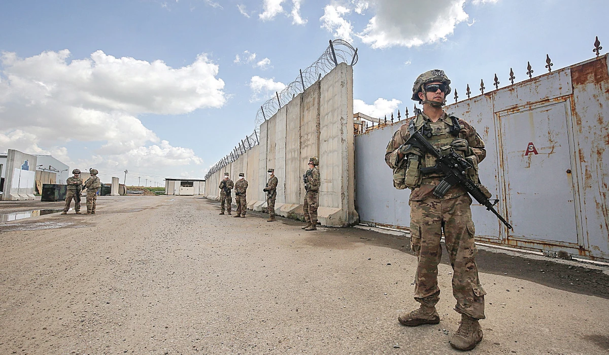 US army soldiers stand on duty at the K1 airbase northwest of Kirkuk in northern Iraq on March 29, 2020. (AFP)