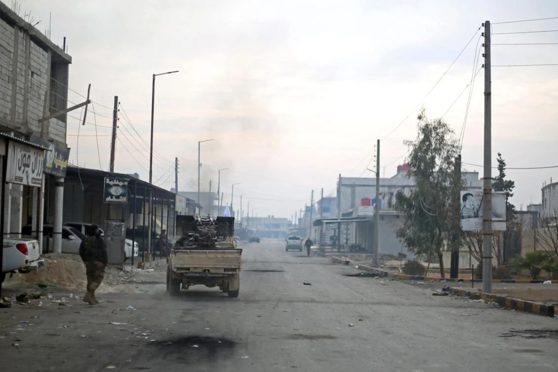 Fighters affiliated with the Turkish-backed Syrian National Army faction, patrol through a road in the northeastern Manbij region, in Aleppo province on January 4, 2025. (File/AFP)