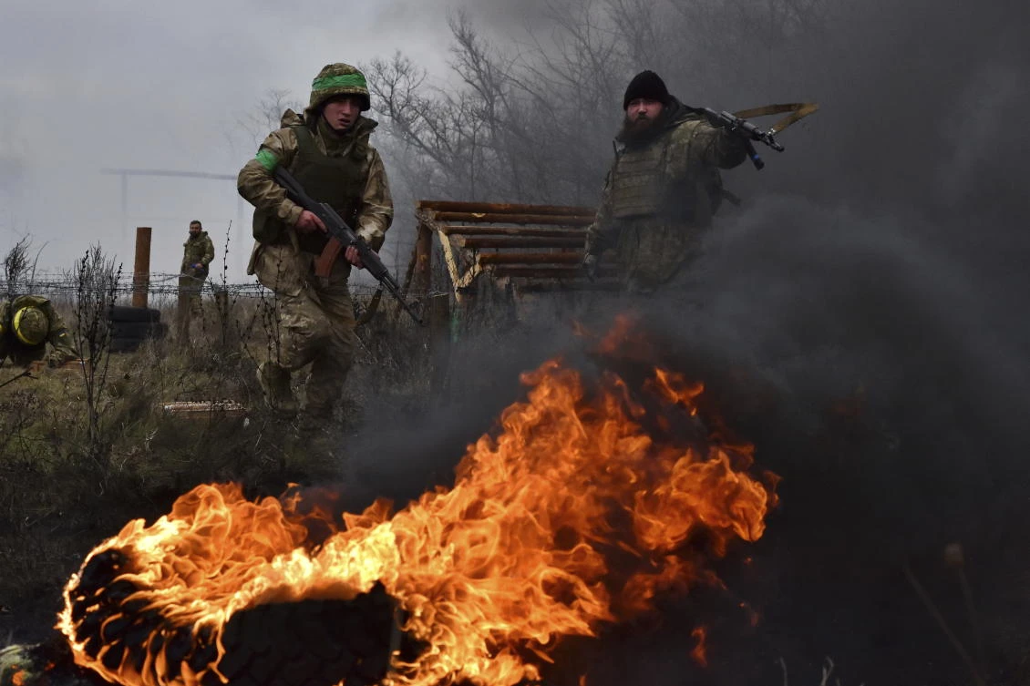 Above, Ukrainian servicemen train at the polygon in the Zaporizhzhia region. Ukraine has hit Russian infrastructure throughout Moscow’s offensive. (Ukraine’s 65th Mechanized Brigade Press Service via AP)