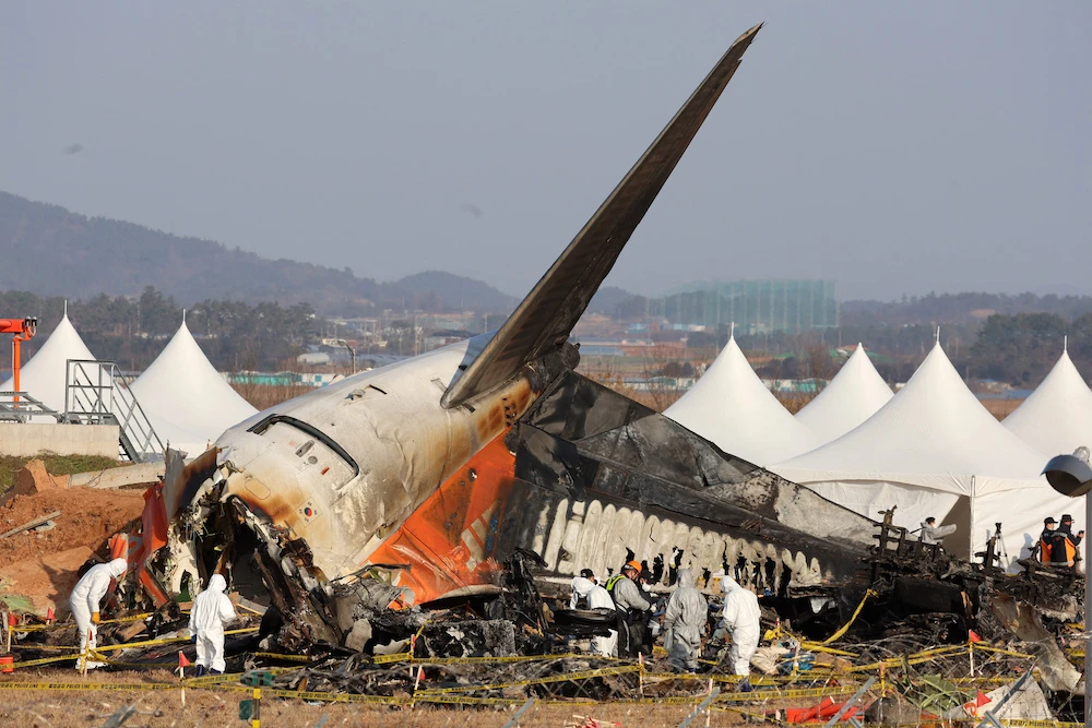 Jeju Air was carrying 181 people from Thailand to South Korea when it made a mayday call and belly-landed before crashing into a barrier and bursting into flames. (AFP)