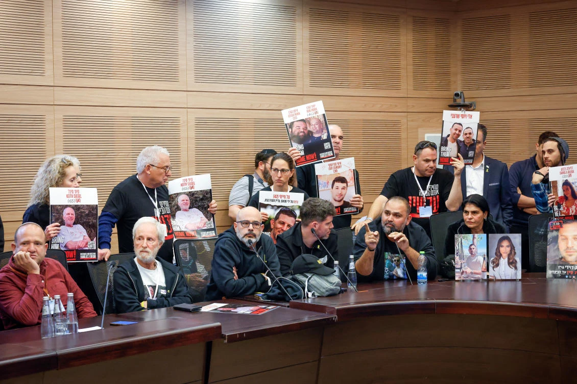 Family members and supporters of hostages kidnapped during the deadly October 7 2023 attack by Hamas protest during a Finance Committee meeting at the Knesset, Israel’s parliament in Jerusalem, January 13, 2025. (Reuters)