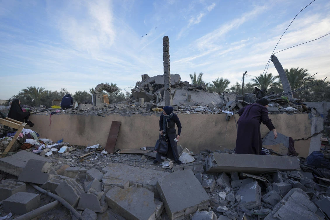 Palestinians inspect the site of an Israeli strike in Deir Al-Balah in the central Gaza Strip, Wednesday, Jan. 15, 2025. (AP)