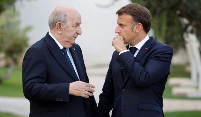 France's President Emmanuel Macron talks with Algeria's President Abdelmadjid Tebboune as they attend the G7 Summit hosted by Italy at the Borgo Egnazia resort in Savelletri on Jun. 13, 2024. (AFP/File)