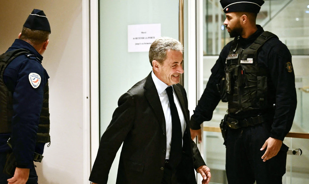 Former French President Nicolas Sarkozy leaves the courtroom in Paris during his trial. (AFP)