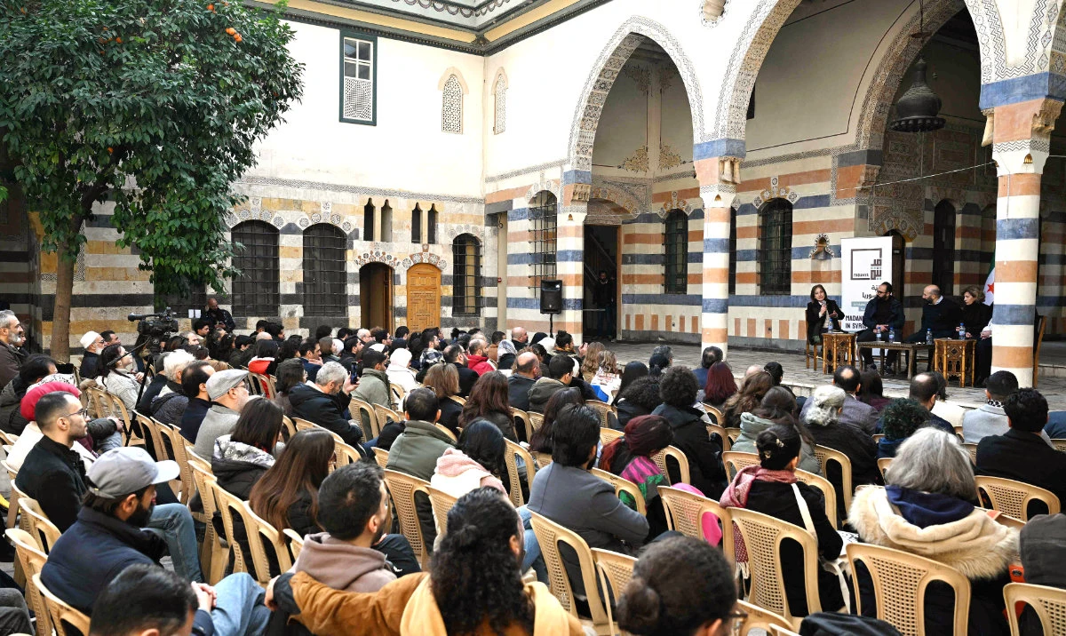 Representatives of Syrian civil society in the courtyard of a traditional house in Old Damascus brainstorm strategies to ensure their country does not return to authoritarianism. (AFP)