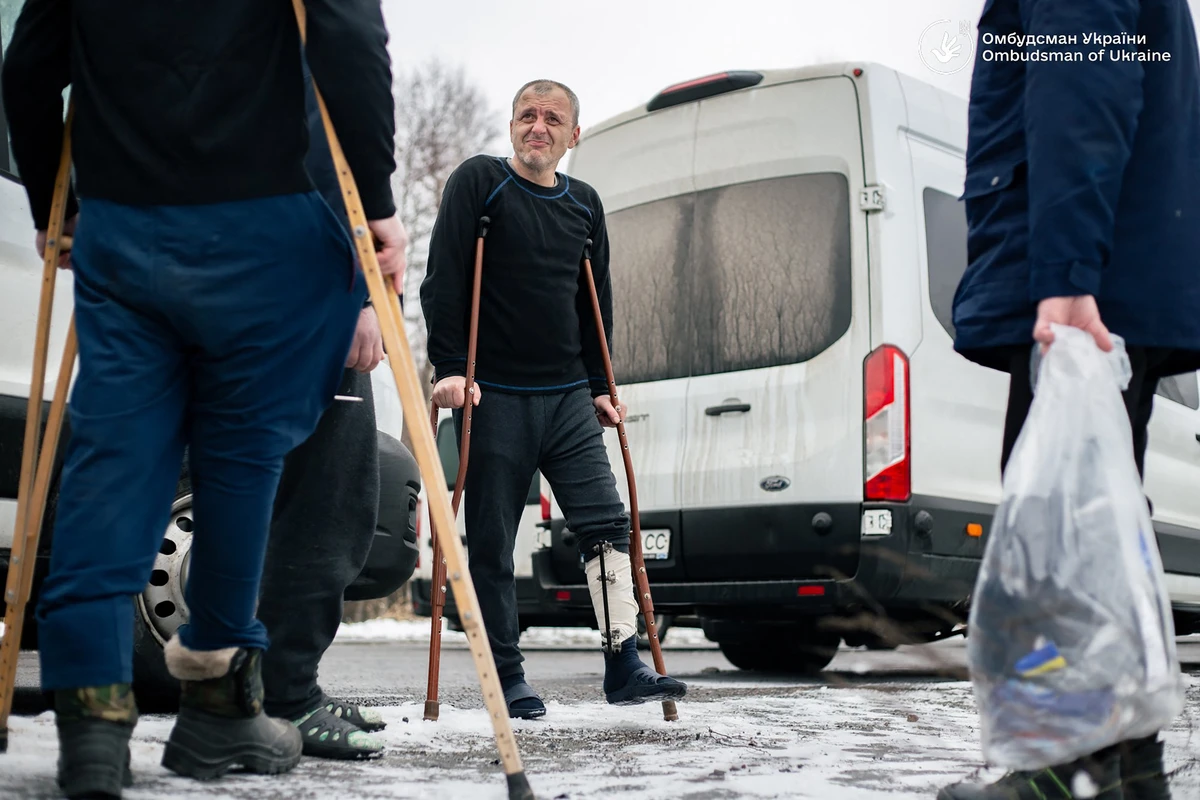 Ukrainian former prisoners of war following a swap, at an undisclosed location in Ukraine, on Jan. 15, amid the Russian invasion of Ukraine (AFP/X ACCOUNT: @LUBINETZS)