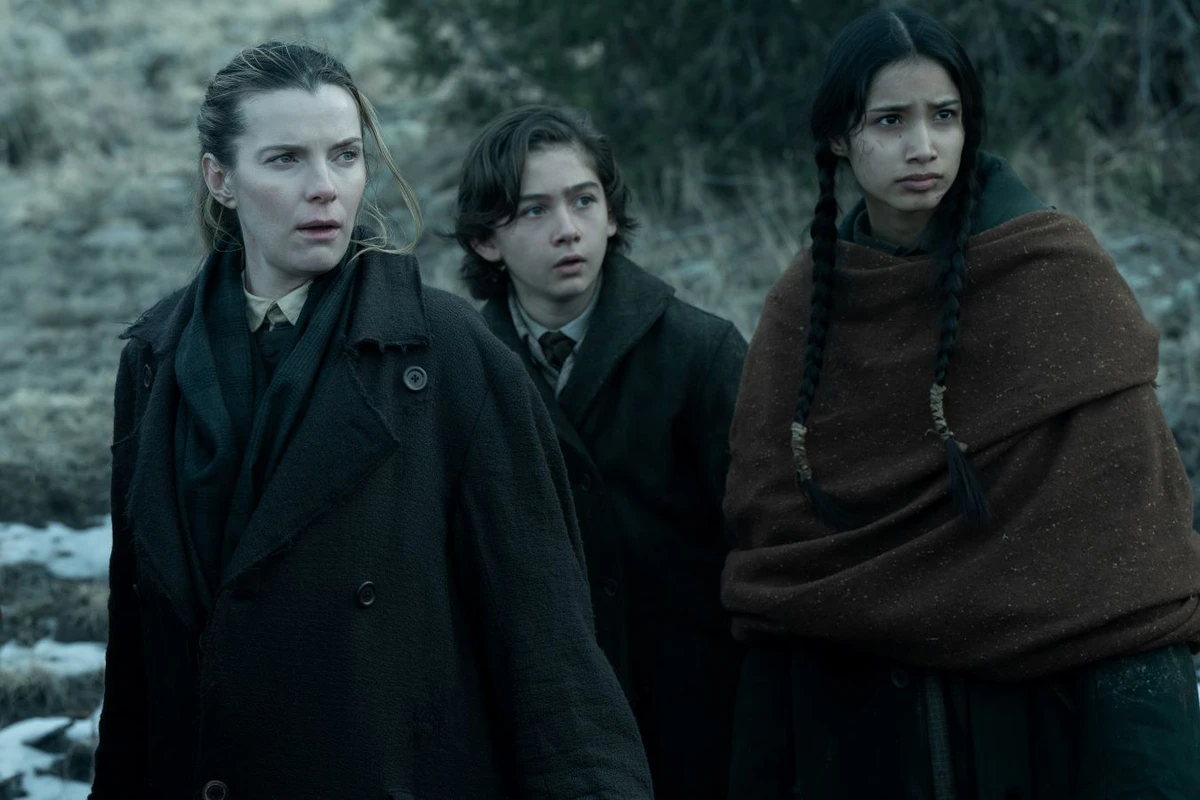 Betty Gilpin as Sara Rowell, Preston Mota as Devin Rowell, and Shawnee Pourier as Two Moons in ‘American Primeval.’ (Netflix)