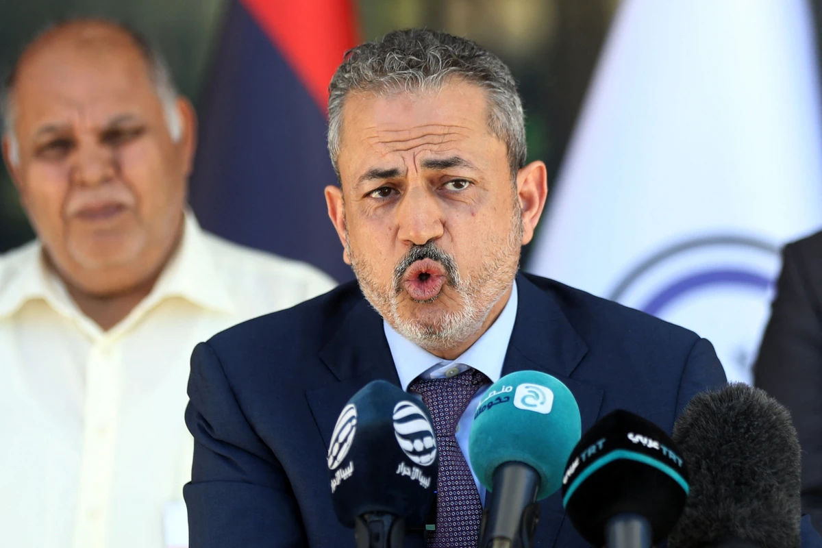 Farhat Bengdara gives a media conference outside Libya’s National Oil Corporation headquarters in Tripoli, July 14, 2022. (File/AFP)