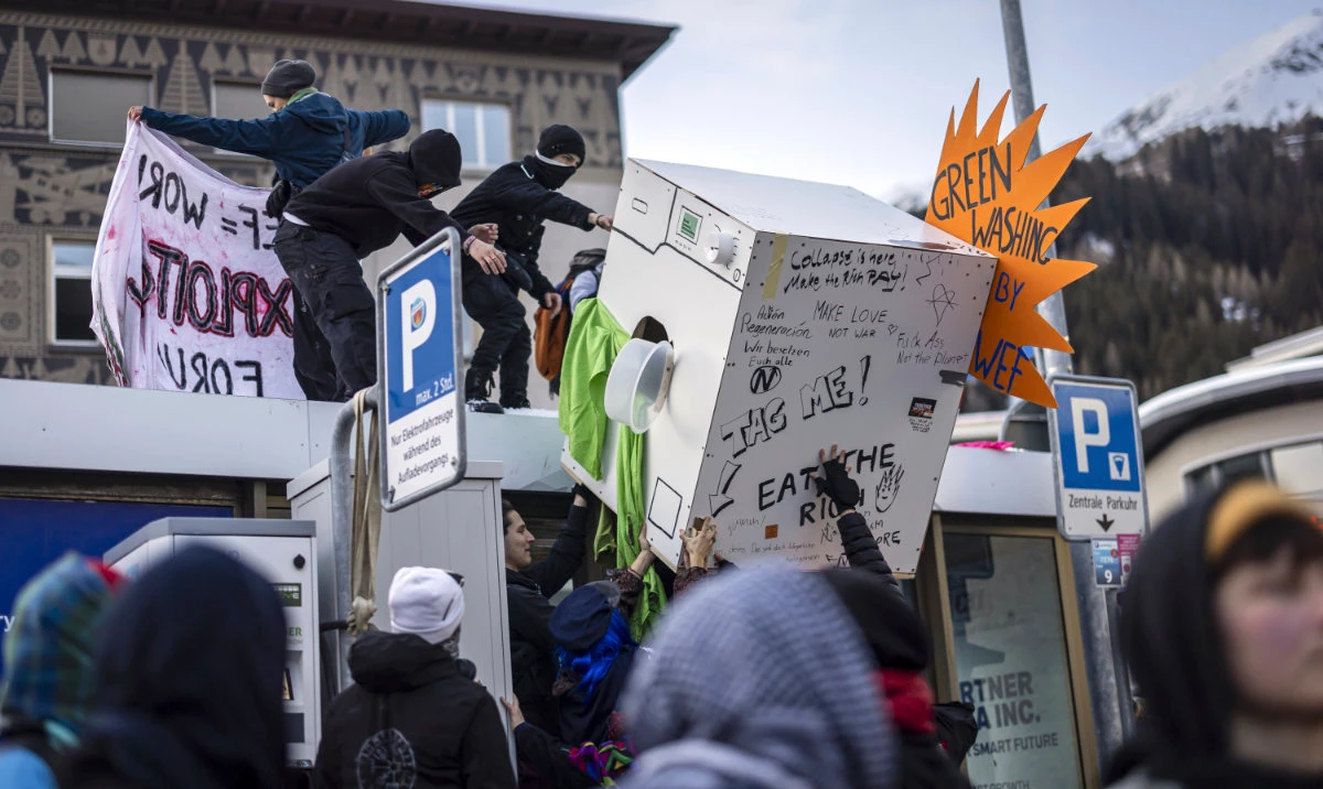 Protesters attend a demonstration before the annual meeting of the World Economic Forum, WEF, in Davos, Switzerland, Sunday Jan. 19, 2025. (AP)