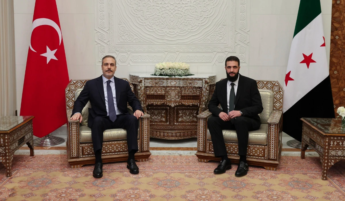 Turkish Foreign Minister Hakan Fidan, left, sits with Ahmad Al-Sharaa during their meeting in Damascus, Syria, Sunday, Dec. 22, 2024. (AP file photo)