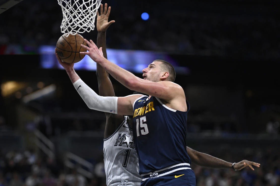 Denver Nuggets center Nikola Jokic goes up to shoot against Orlando Magic forward Jonathan Isaac during the first half of their NBA game on Jan. 19, 2025 in Orlando, Florida. (AP)