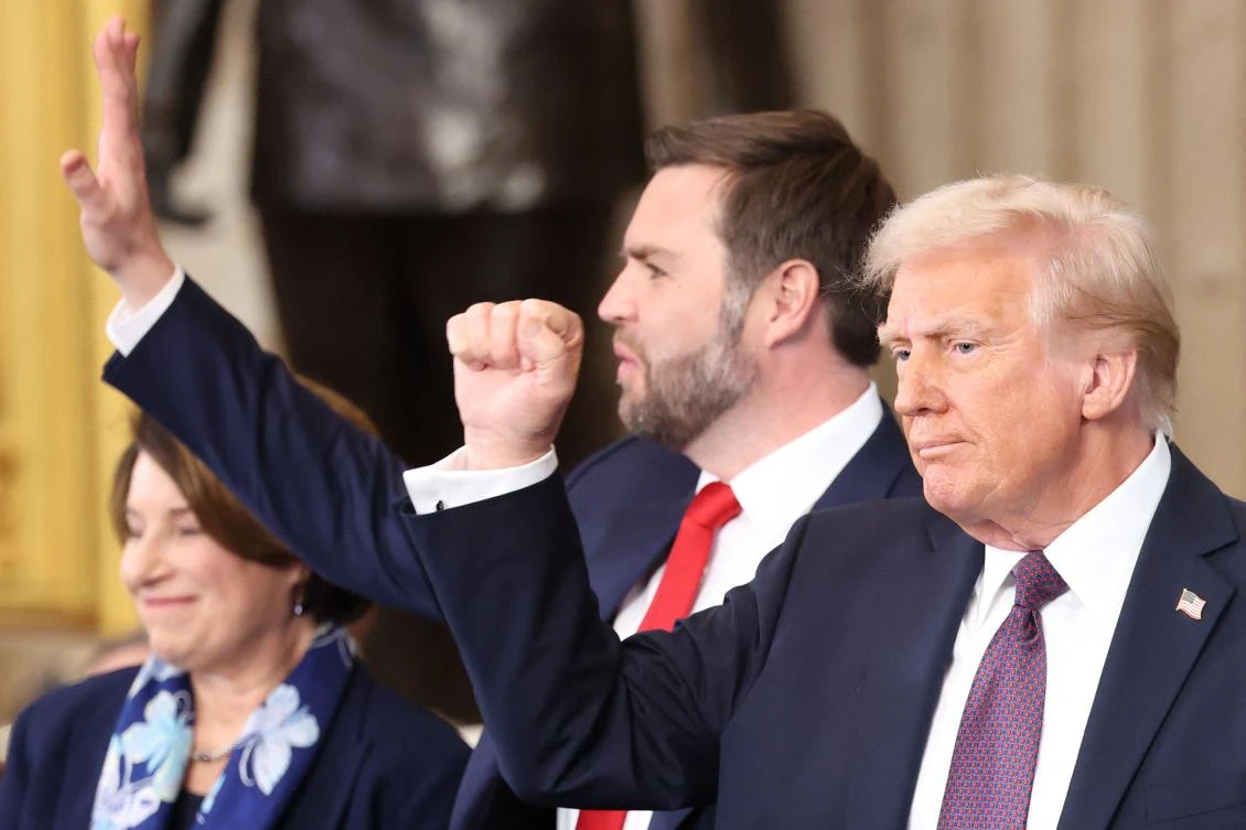 US President Donald Trump and Vice President J.D. Vance gesture during their inauguration in the Rotunda of the US Capitol in Washington, DC, on January 20, 2025. (AFP)