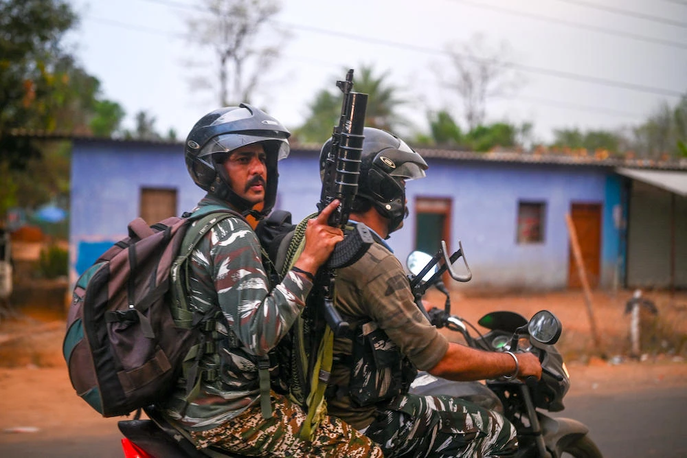 Above, Central Reserve Police Force personnel patrol Dantewada district in Chhattisgarh on April 16, 2024. New Delhi has deployed tens of thousands of troops in efforts to end the decades-long Maoist rebellion. (AFP file photo)