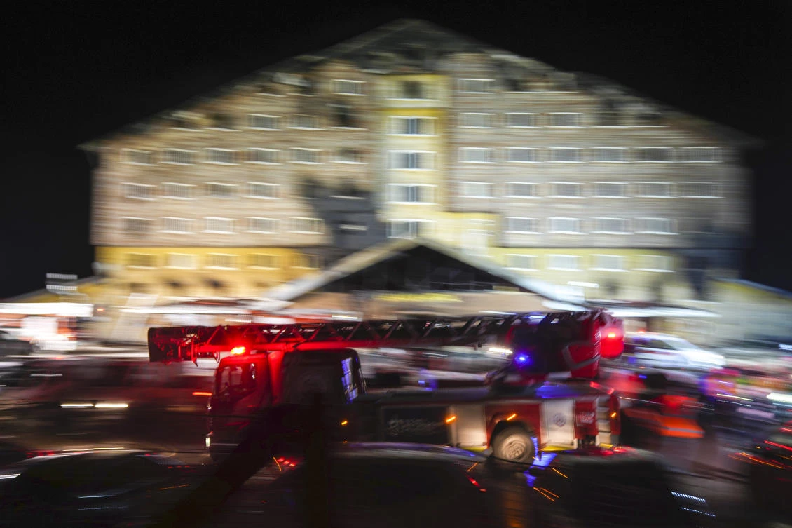 A firefighting truck leaves the scene where a fire broke out at a hotel in the ski resort of Kartalkaya, located in Bolu province, northwest Turkiye, on Tuesday, Jan. 21, 2025. (AP)