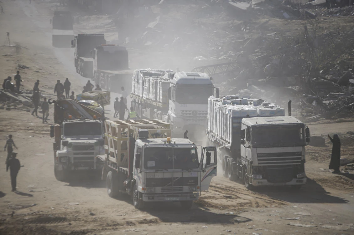 Humanitarian aid trucks enter through the Kerem Shalom crossing from Egypt into the Gaza Strip. (AP)