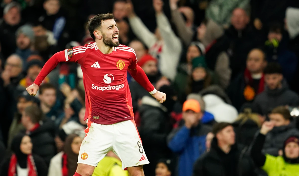 Manchester United’s Bruno Fernandes celebrates after scoring his side’s second goal during the Europa League opening phase soccer match between Manchester United and Glasgow Rangers in Manchester, England, Thursday. (AP)