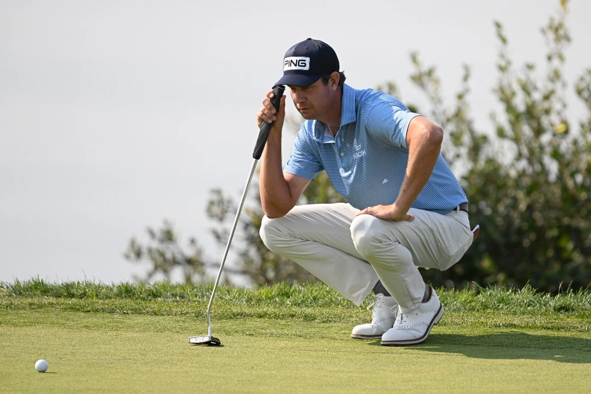 Harris English lines up a putt on the fourth hole on the South Course at Torrey Pines during the third round of the Farmers Insurance Open golf tournament Friday in San Diego. (AP)