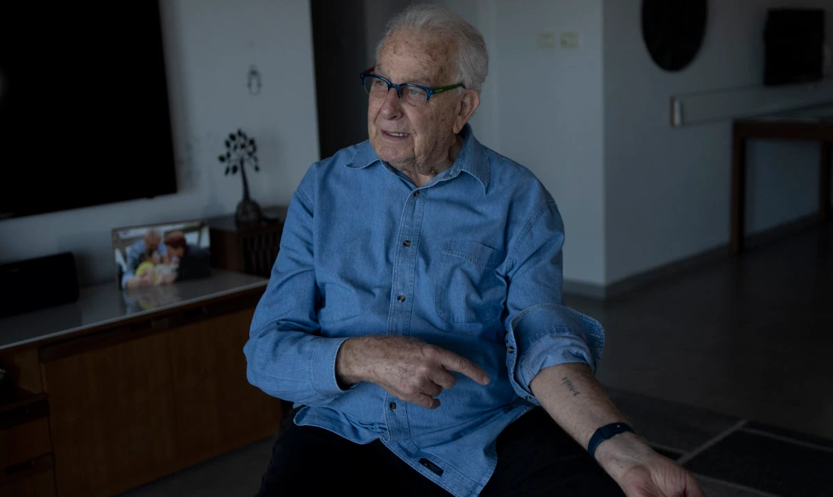 At his home in Haifa, Israel, Holocaust survivor Naftali Fürst shows the numbers that were tattooed on his arm when he was imprisoned at Auschwitz, Tuesday, Jan. 14, 2025. (AP)