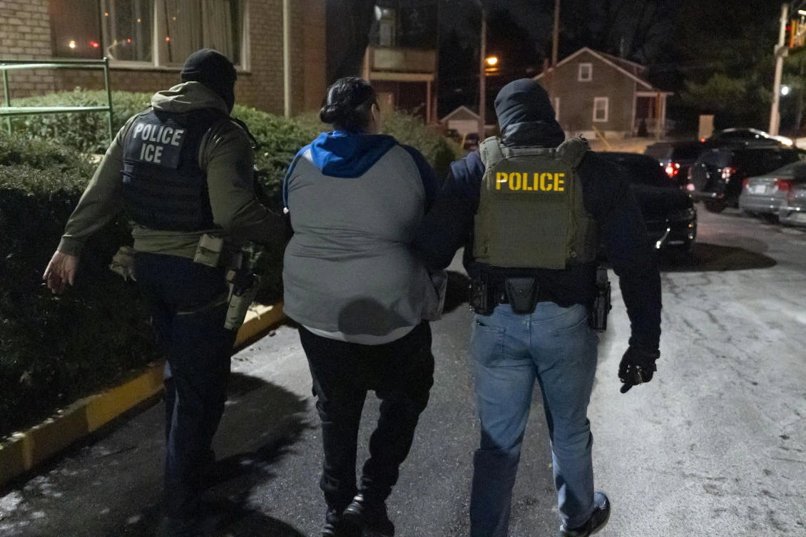 US Immigration and Customs Enforcement officers detain a person on Jan. 27, 2025, in Silver Spring, Maryland. (AP)
