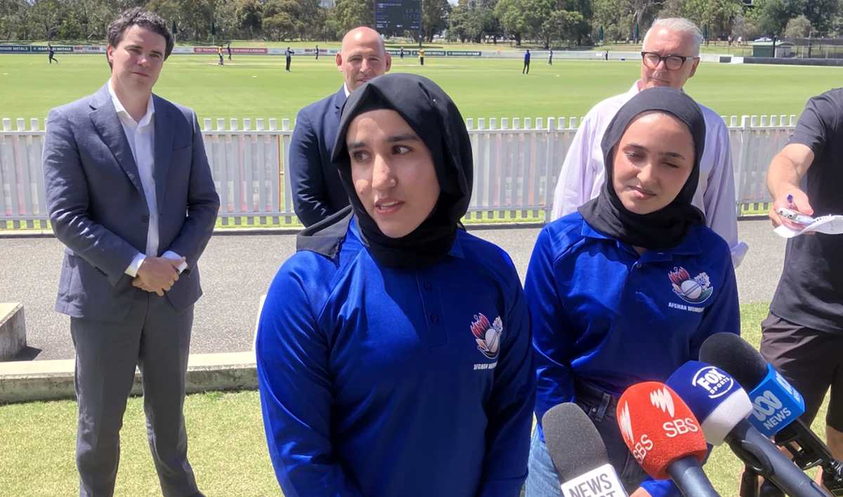 Afghan women cricketers Nahida Sapan, left, and Firooza Amiri speak to reporters at Junction Oval in Melbourn Monday. (AP)
