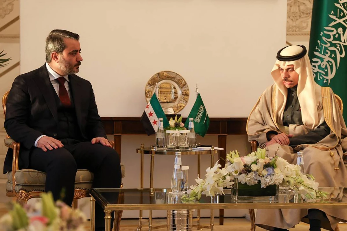 Syria’s Foreign Minister Asaad Al-Shaibani (L) meets with his Saudi counterpart Prince Faisal bin Farhan Al-Saud (SANA/AFP)