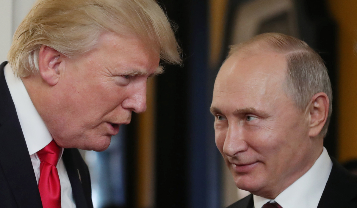 Donald Trump (L) chats with President Vladimir Putin as they attend the APEC Economic Leaders' Meeting in Vietnam. (AFP file)