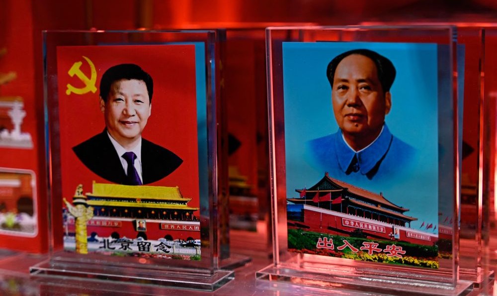 Portraits of Xi Jinping and Mao Zedong at a souvenir shop in a tourist area of Beijing, China, Feb. 26, 2025. (AFP)