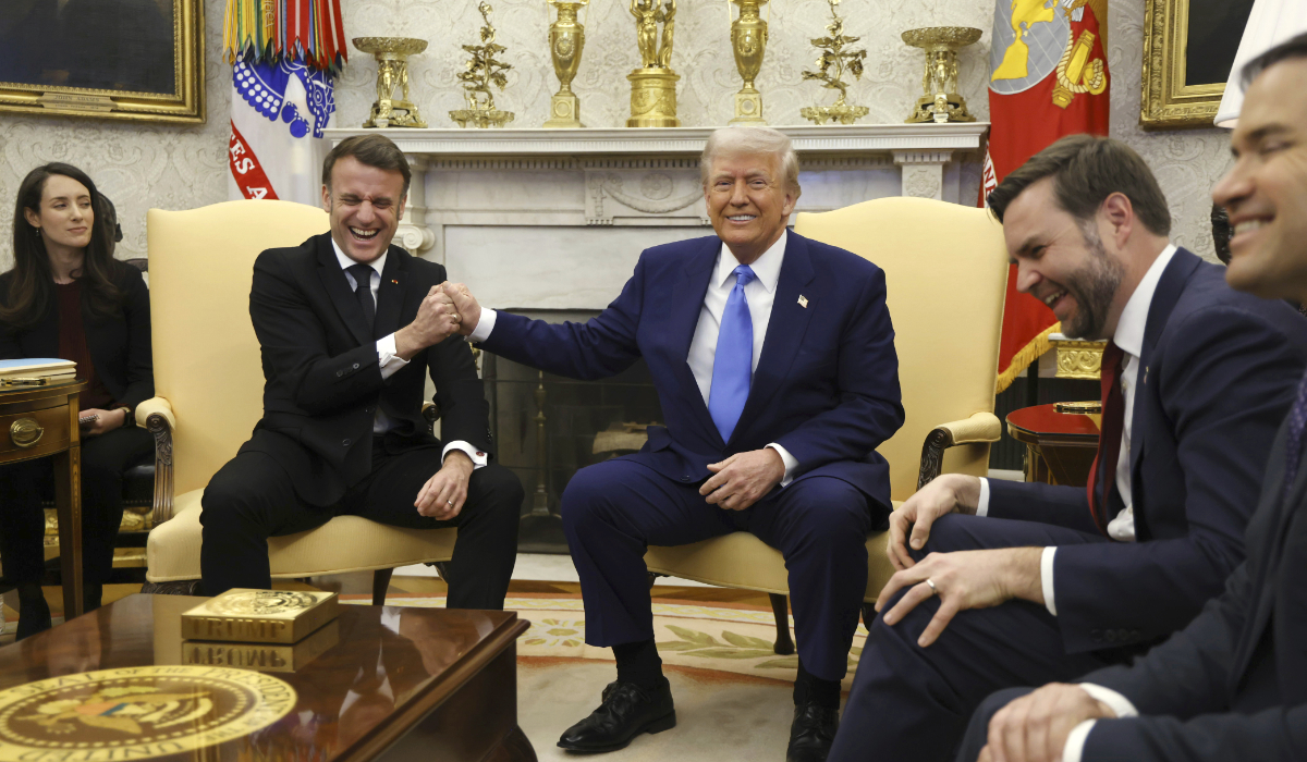 France's President Emmanuel Macron, left, speaks with President Donald Trump in Washington, Monday, Feb. 24, 2025. (AP)