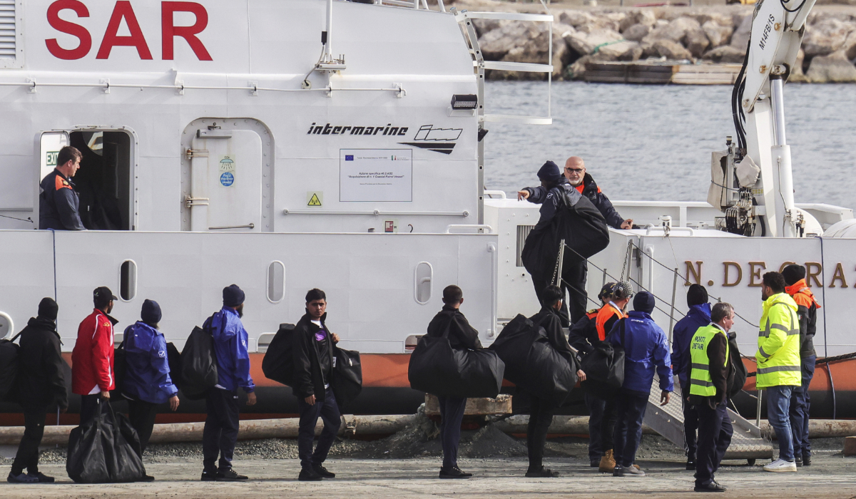 Migrants board an Italian Coast Guard vessel as part of a transfer operation from the asylum processing centers in Albania back to Italy following a court decision in Rome, at the port of Shengjin, northwestern Albania, Saturday, Feb. 1, 2025. (AP)