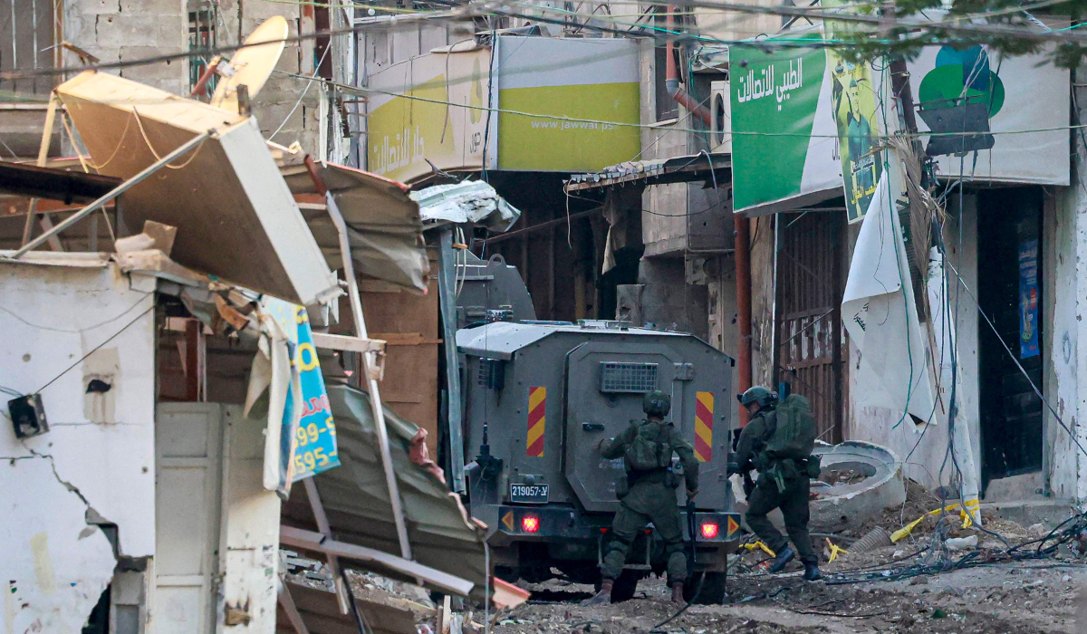 Israeli army soldiers keep position in raid in Tulkarem camp on September 10, 2024, amid a large-scale military offensive launched a week earlier in the occupied West Bank. (AFP)