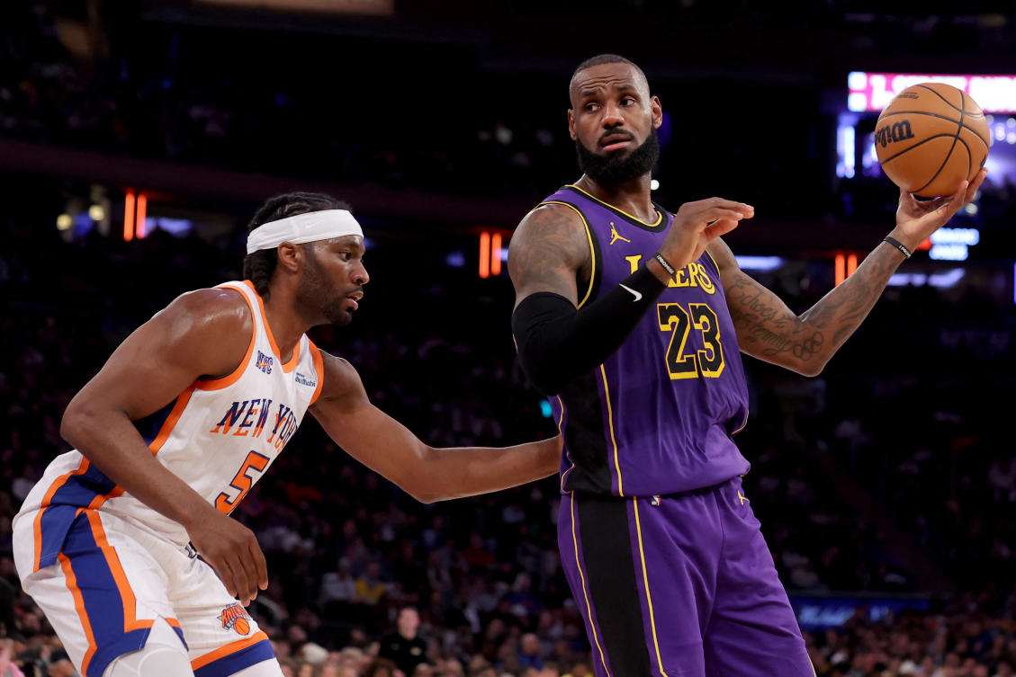 Los Angeles Lakers forward LeBron James controls the ball against New York Knicks forward Precious Achiuwa during the third quarter at Madison Square Garden. (Imagn Images)