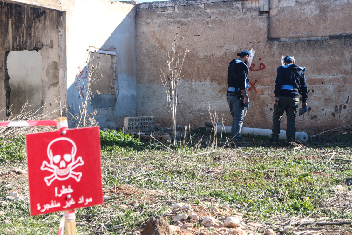 An EOD team deals with a Russian-made 220mm Uragan thermobaric_rocket rocket found at a site in Luf village, Saraqib district of Idlib governorate in Syria. (The HALO Trust photo)