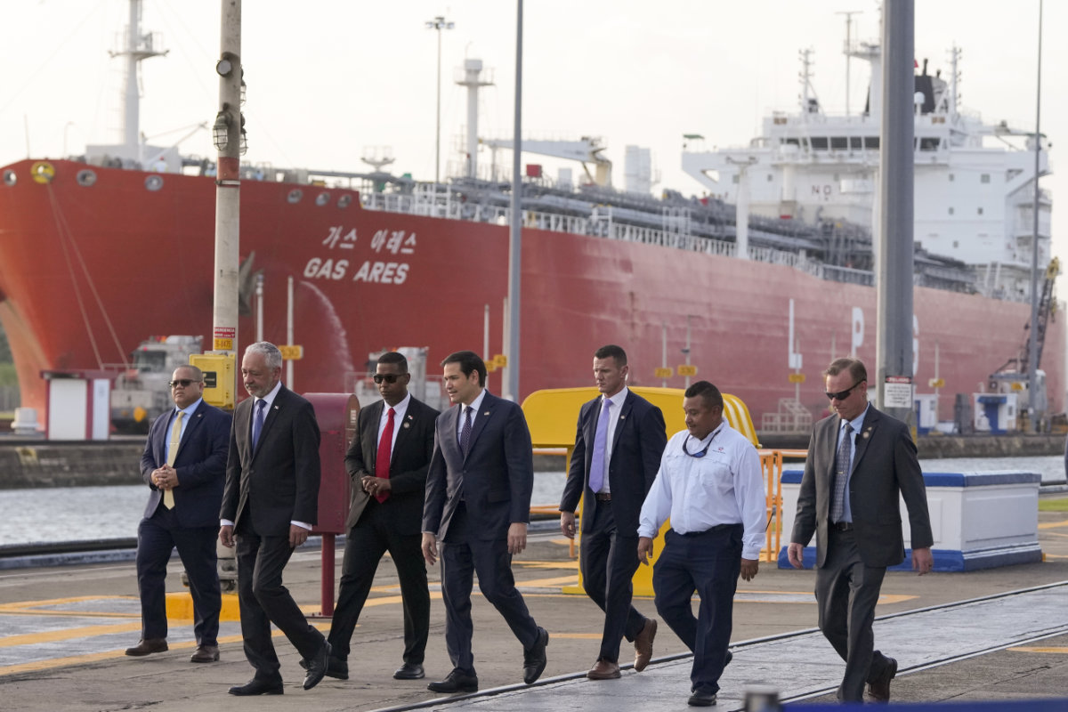 US Secretary of State Marco Rubio, 4th from left, tours the Miraflores locks at the Panama Canal in Panama City on Feb. 2, 2025. (AP Photo/Pool)